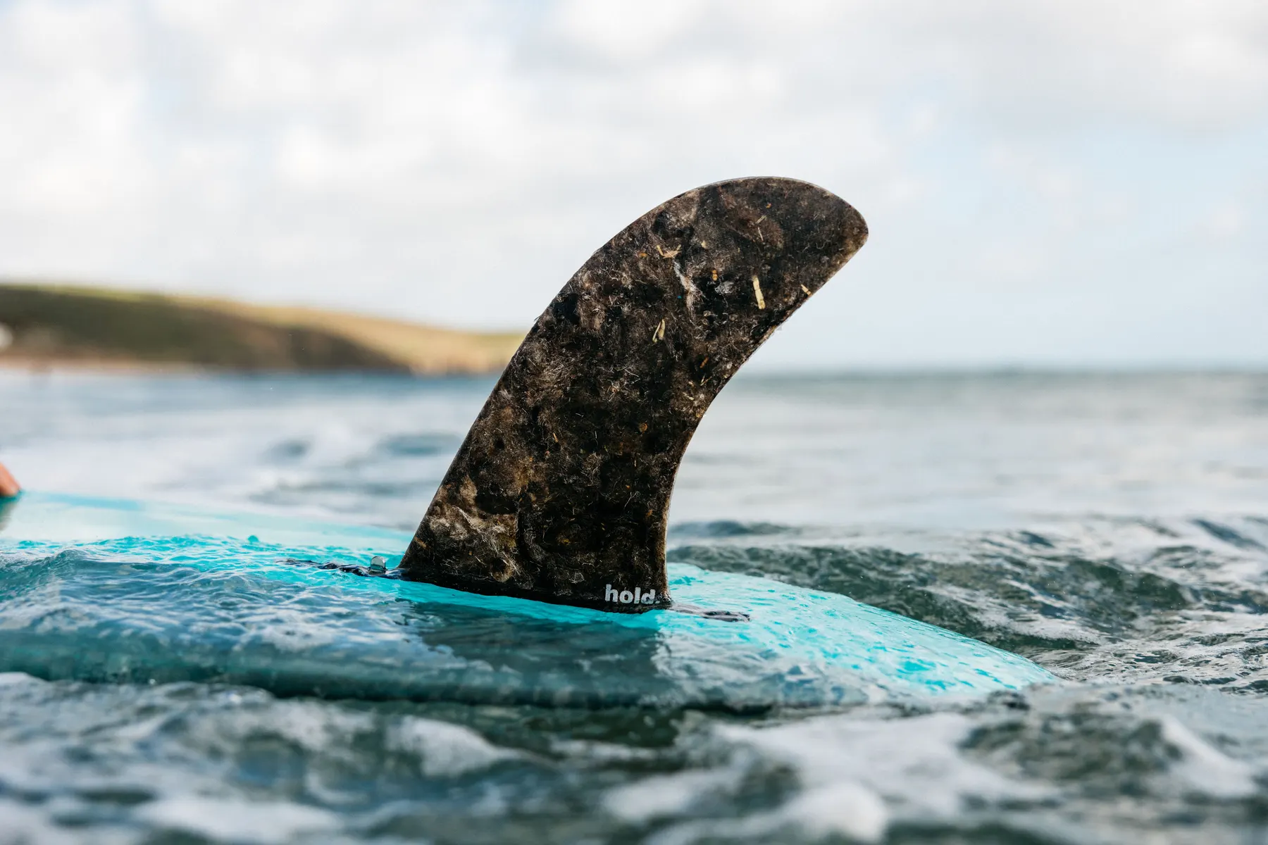 Hold fin in the water with the logo visible.