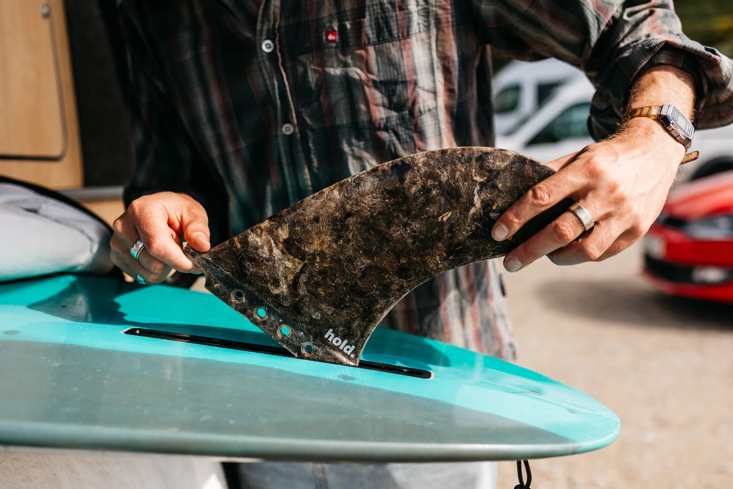 James placing material for a Hold fin made with recycled surfboard offcuts.