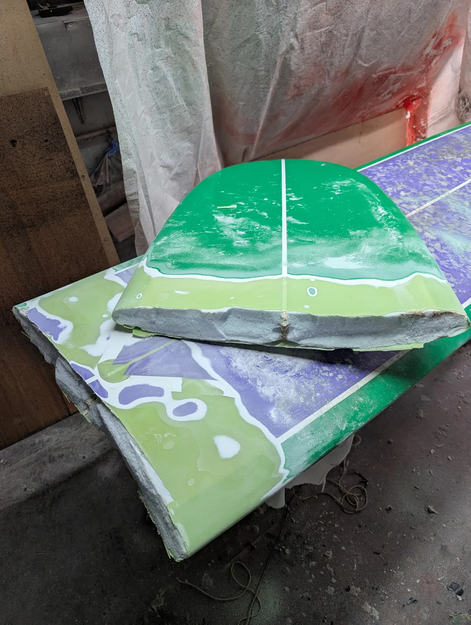 A damaged surfboard before repair by Whitburn Studio.